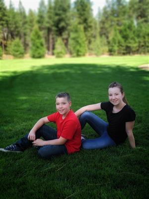 kids sitting on grass