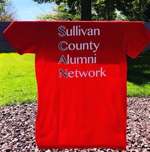 A red t - shirt with the words sulllivan county, alumini