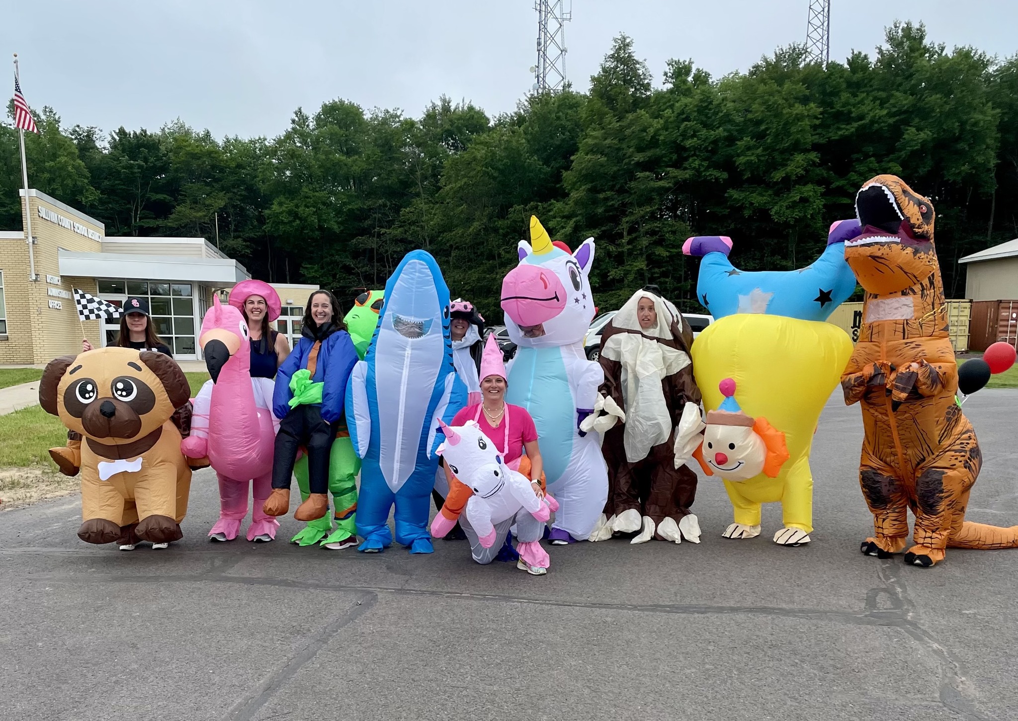 a group of teachers in funny inflatable animal costumes