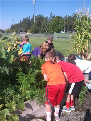 group of students in a garden