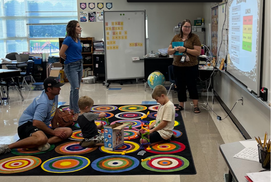 Teacher teaching family