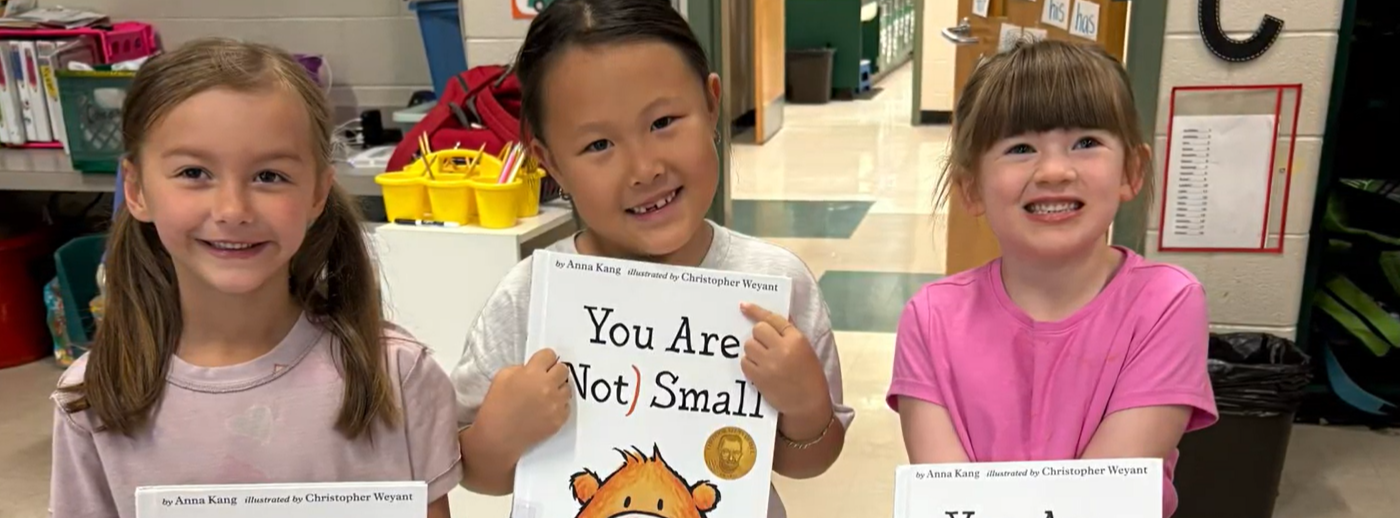 children holding books
