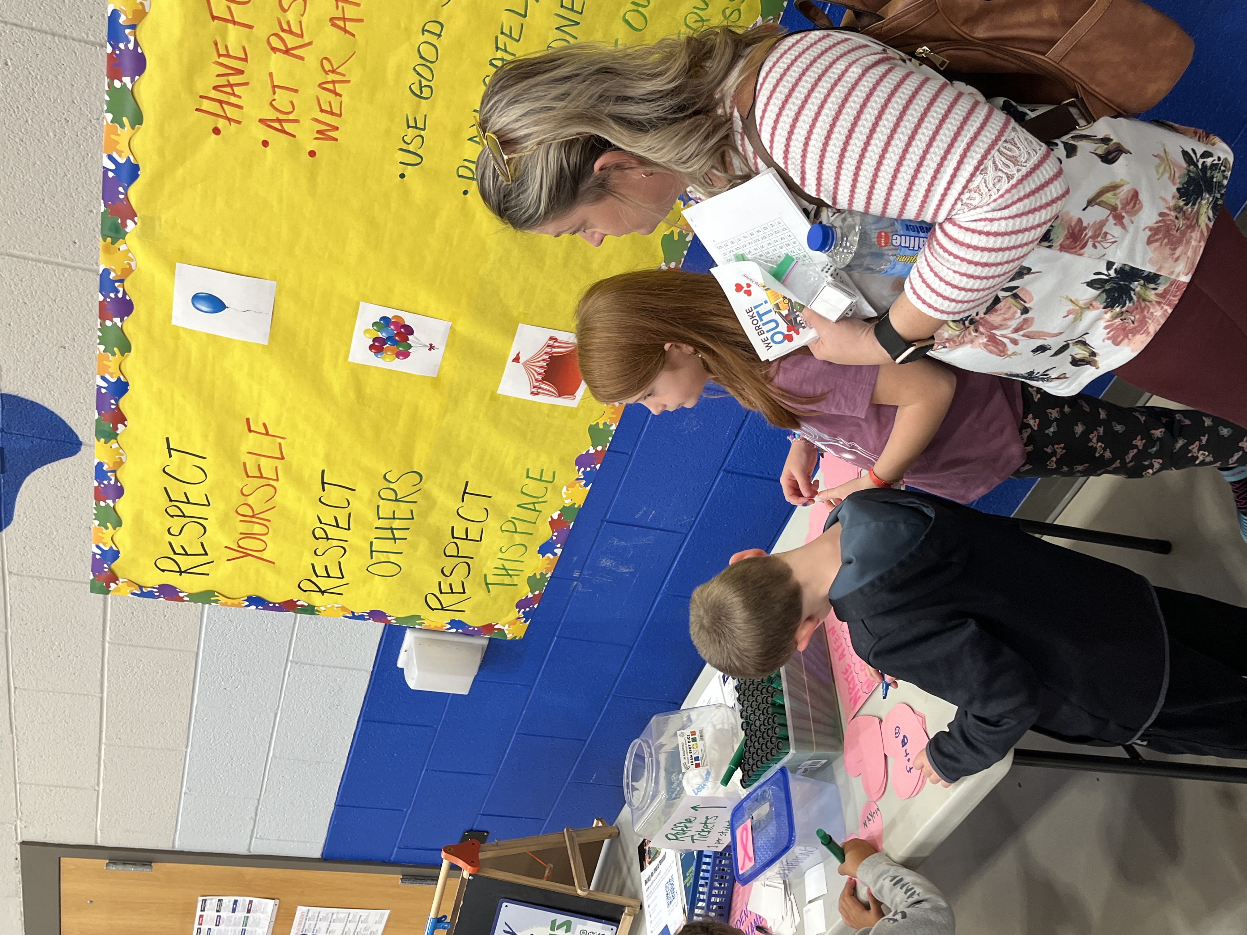 parent standing with student