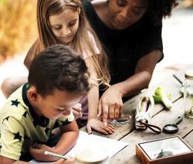 teacher helping students with activities