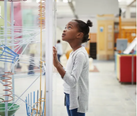 female student looking at a display