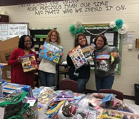 Teachers showing donated gifts 