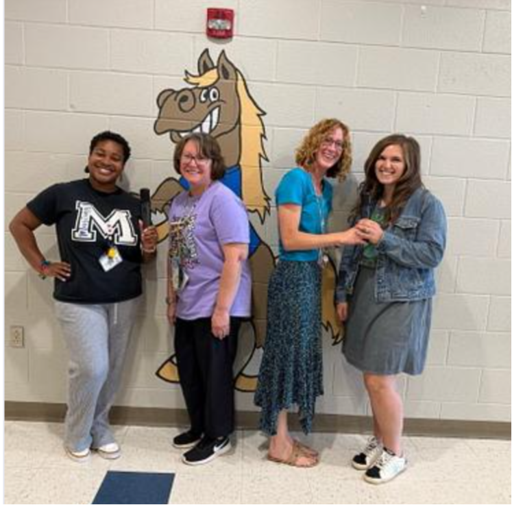 Kindergarten teachers with wireless microphones to use for Awards Day