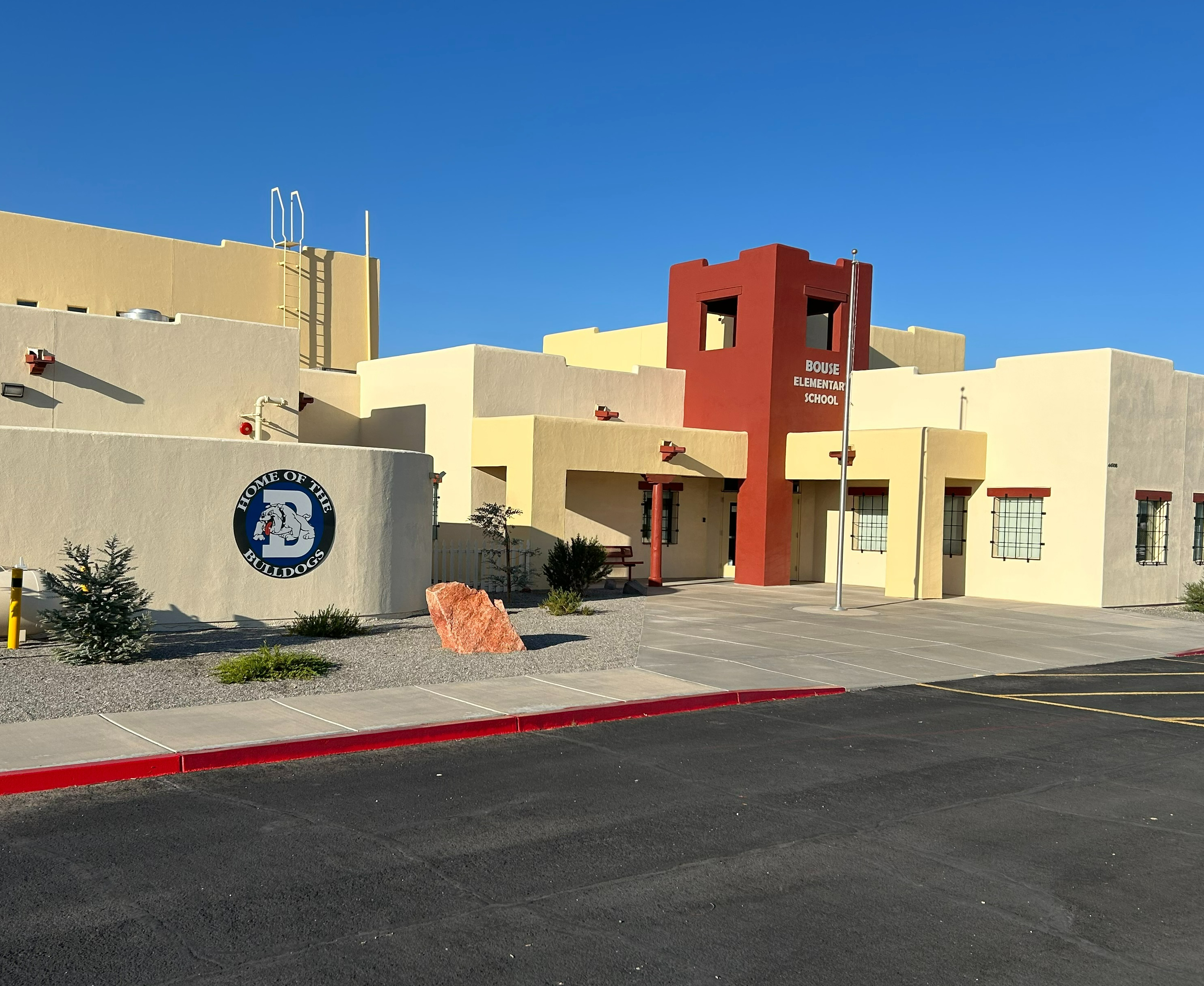 Outside of Bouse Elementary School building with rainbow in background