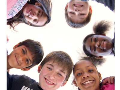 A group of young children standing in a circle