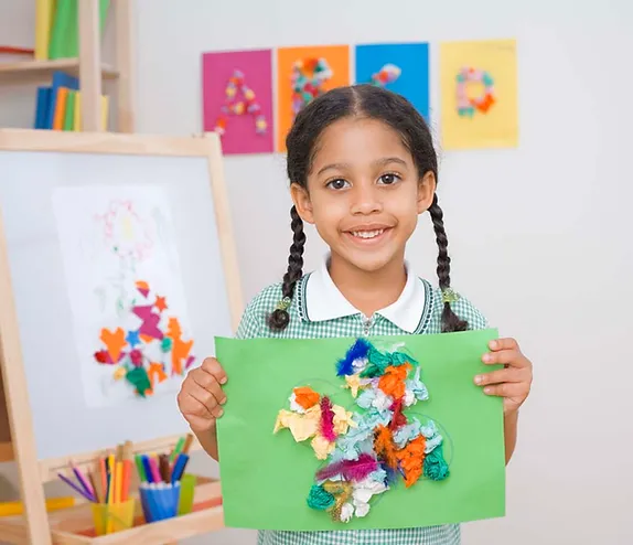 kid holding a sheet of  paper