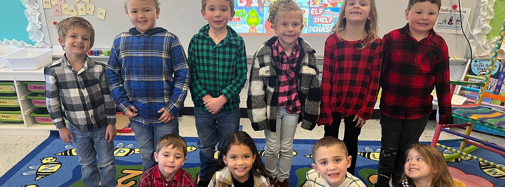 group of little students wearing flannel shirts each