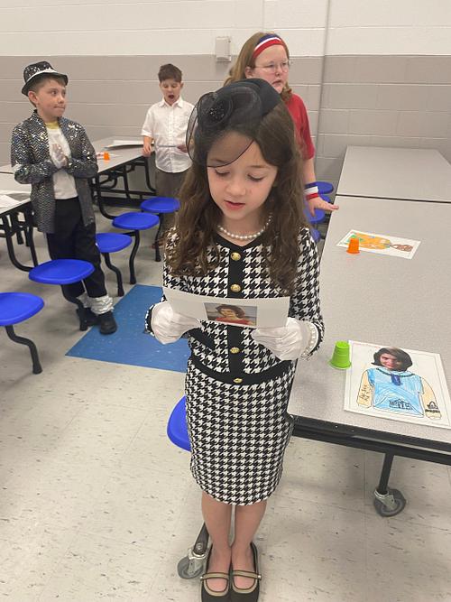 Stuuent dressed as famous American for Wax museum