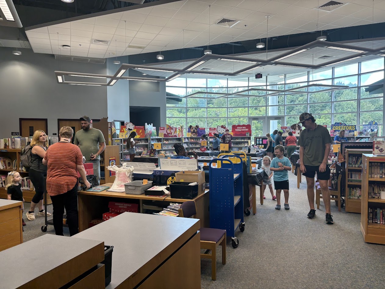 Families shop at the Book Fair during the Harvest Festival