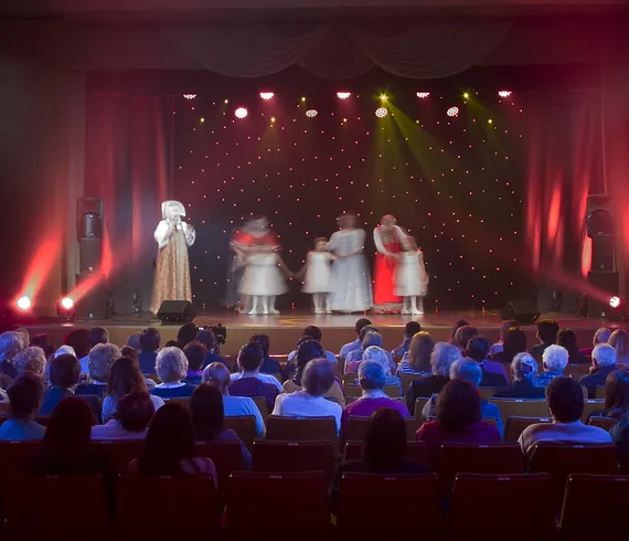 students performing on stage 