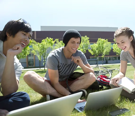 3 people using a laptop