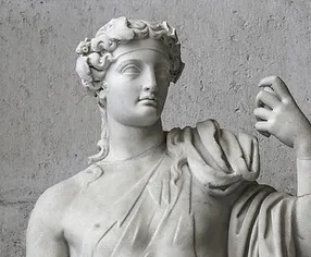 Ancient Stone Sculpture of Apollo with one hand raised