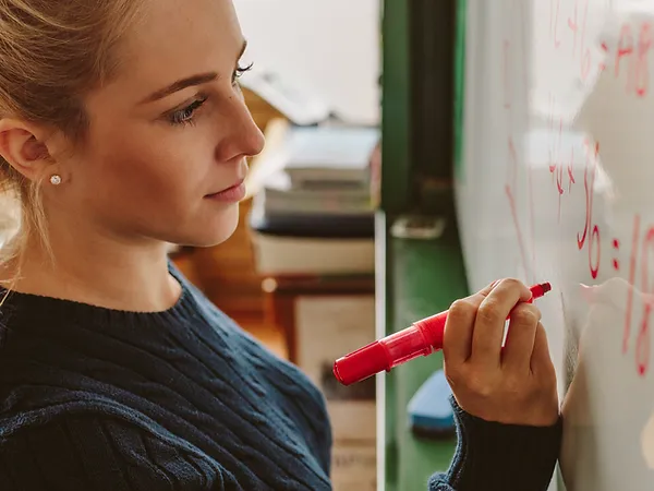 Student Writing on Board