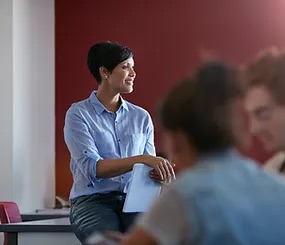 female teacher looking confident at her classroom