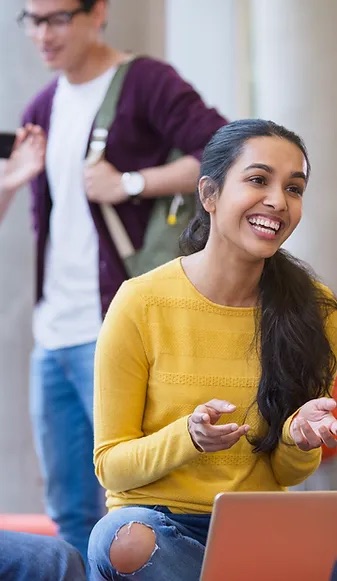 student laughing with someone