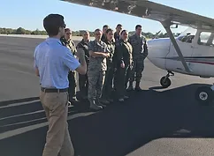 pilot teaching students about airplanes