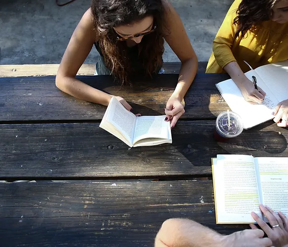 students reading a book