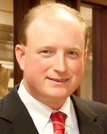 an image of a man wearing red necktie