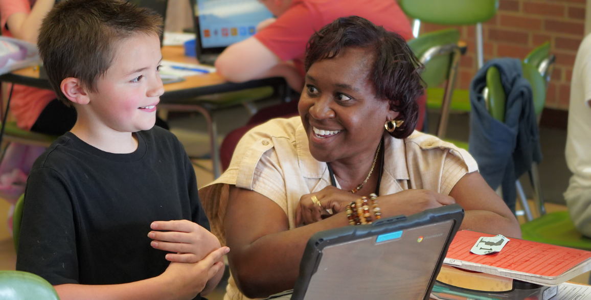 Female teacher with student at International Baccalaureate school