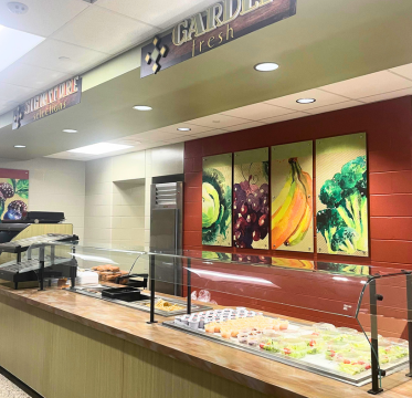 School cafeteria lunch line with fresh food options