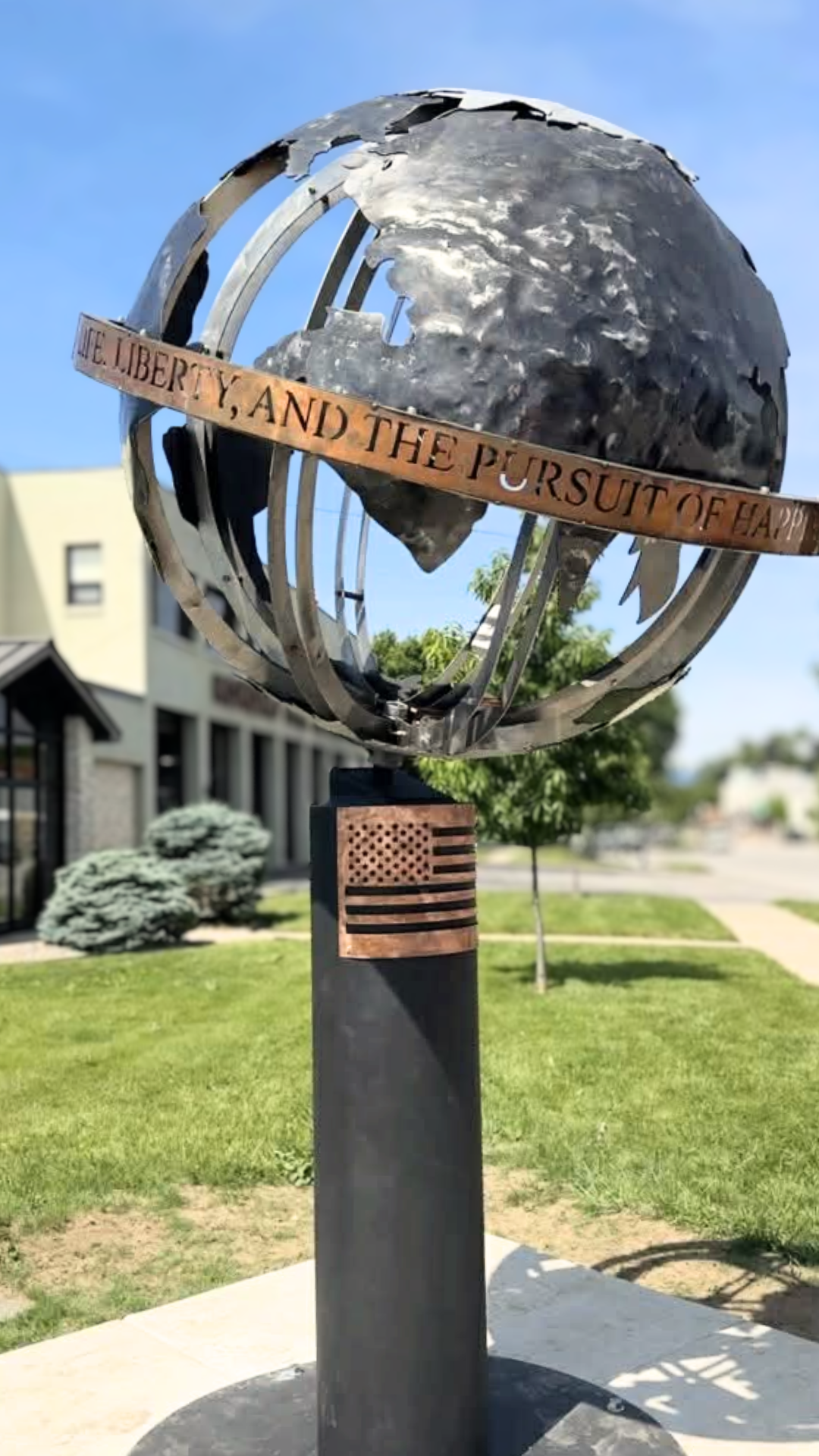 metal globe scuplture