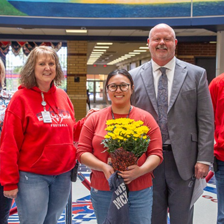 MBHS's Ms. Le receiving recognition from the superintendent and campus principal