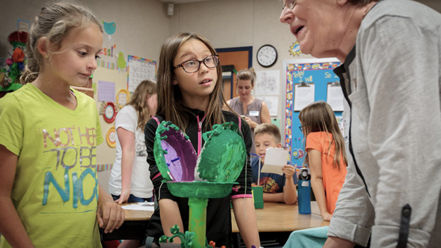 teacher talking to students