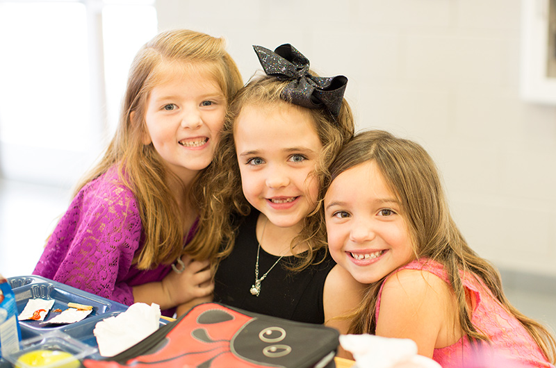 Bennett Elementary students enjoying lunchtime with friends.