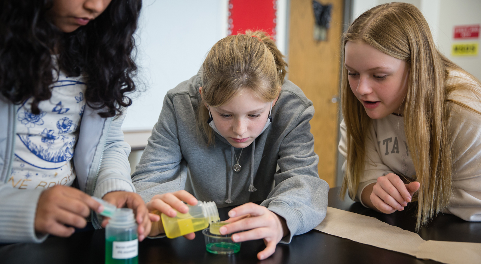 students working on a science fair project