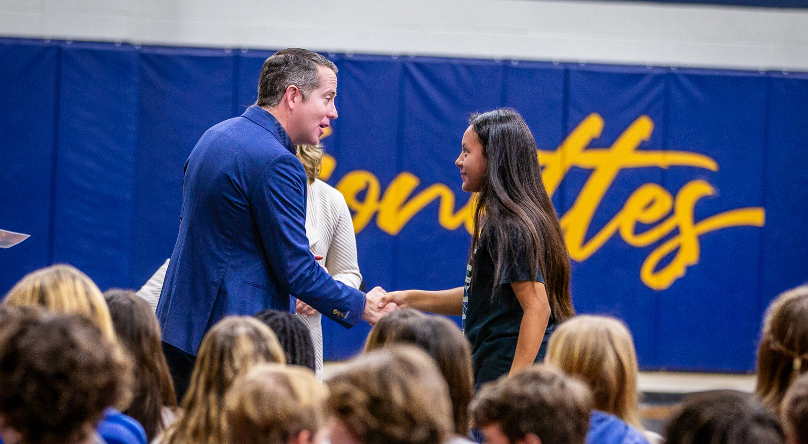 board president philip hassler greeting students