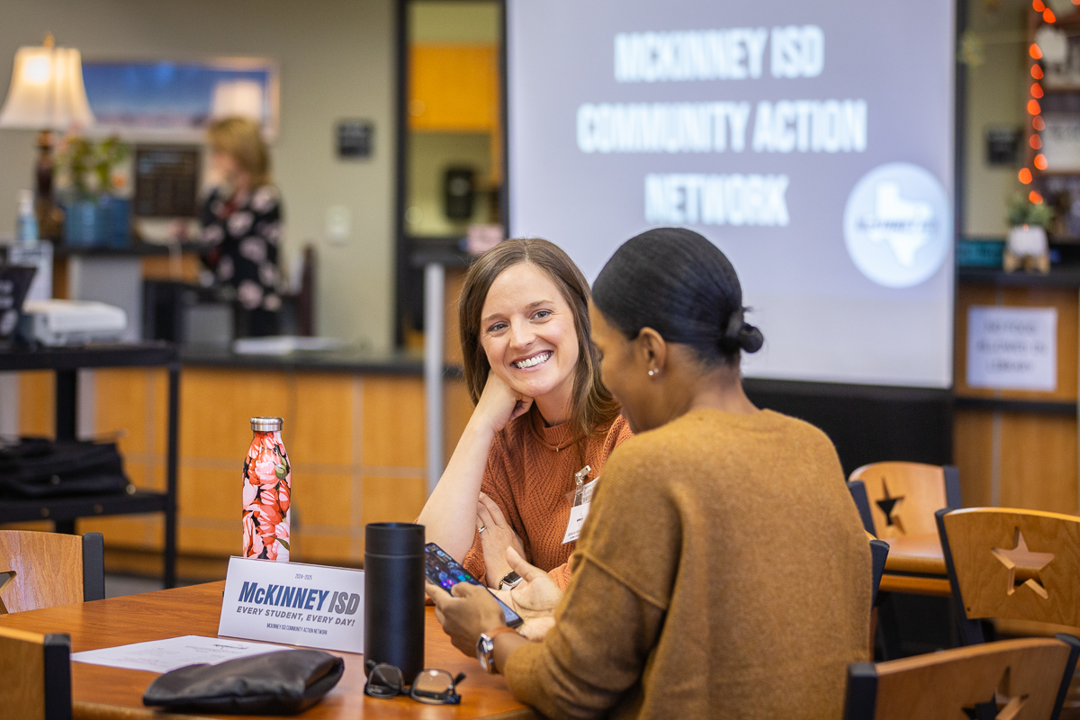 two people participate in a discussion during a McKinney community action network meeting 