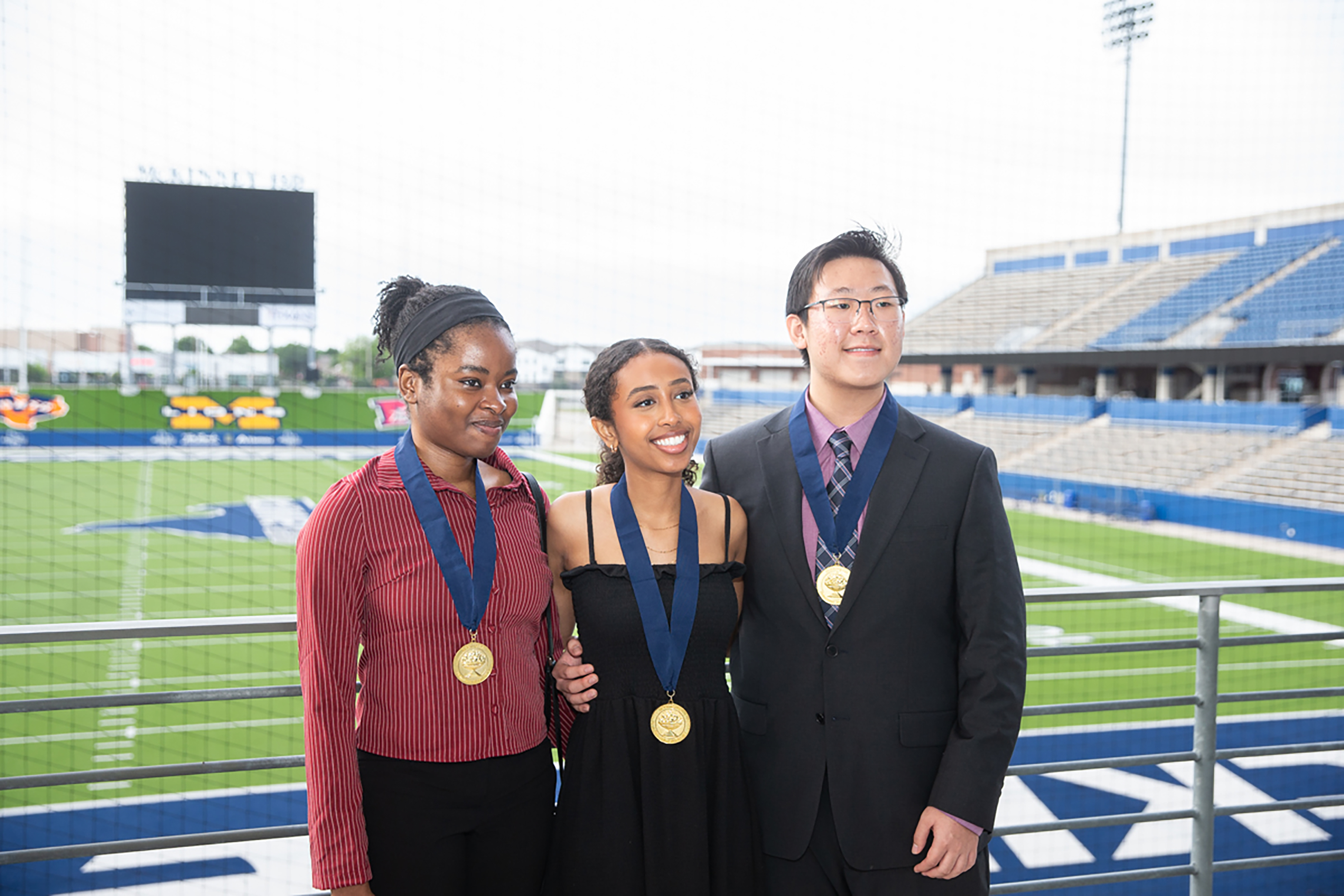 three mckinney isd students with their distinguished student awards 