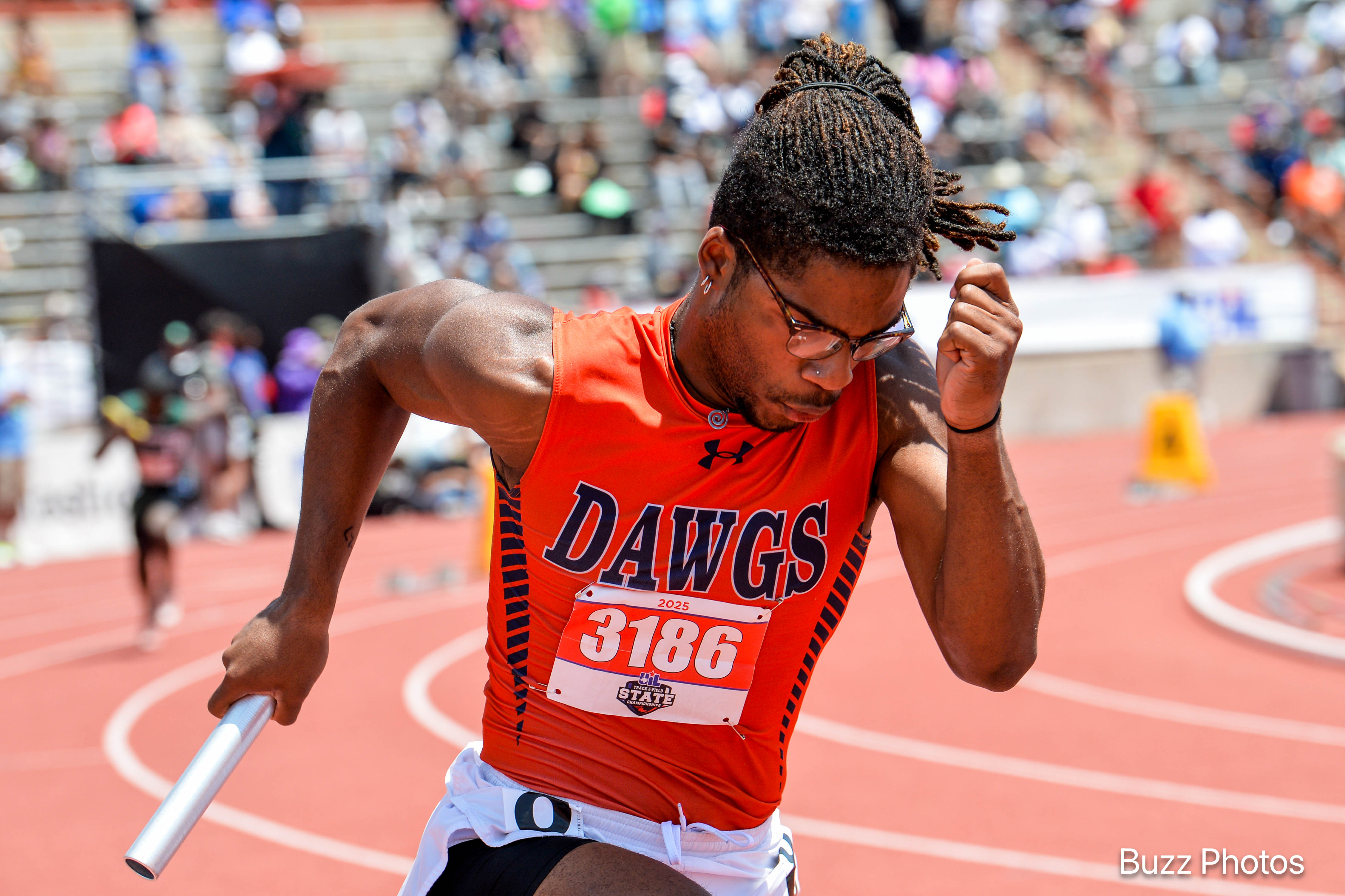 a mckinney north student competes in a track event