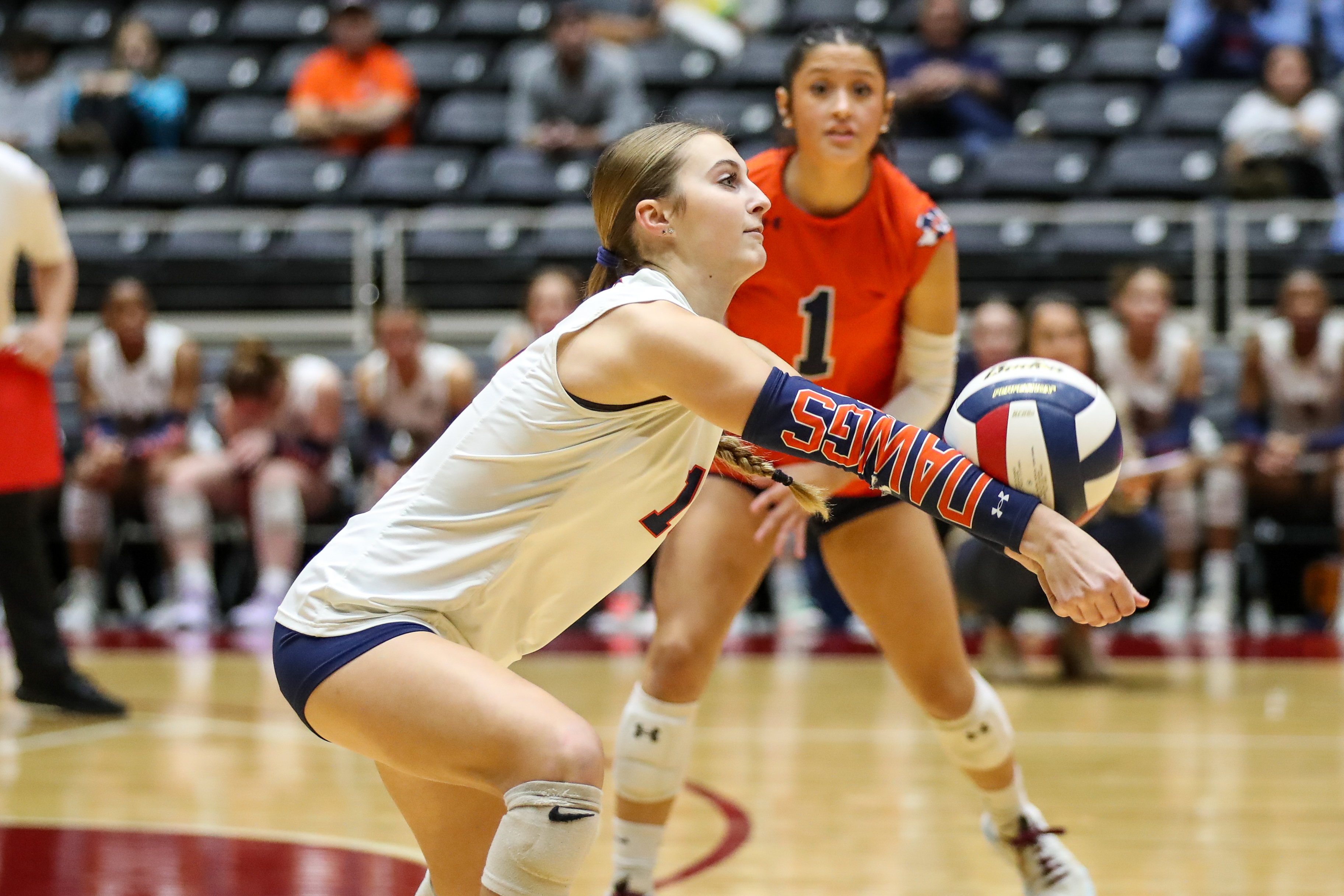 a mckinney north students serves a volleyball
