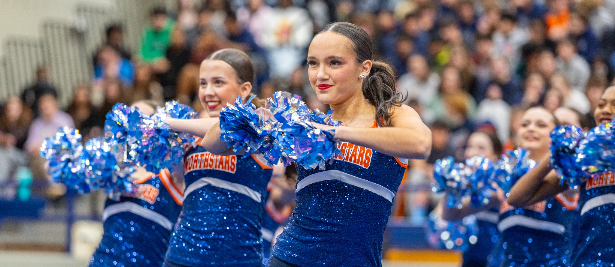 mckinney north stars drill team performs at a pep rally 