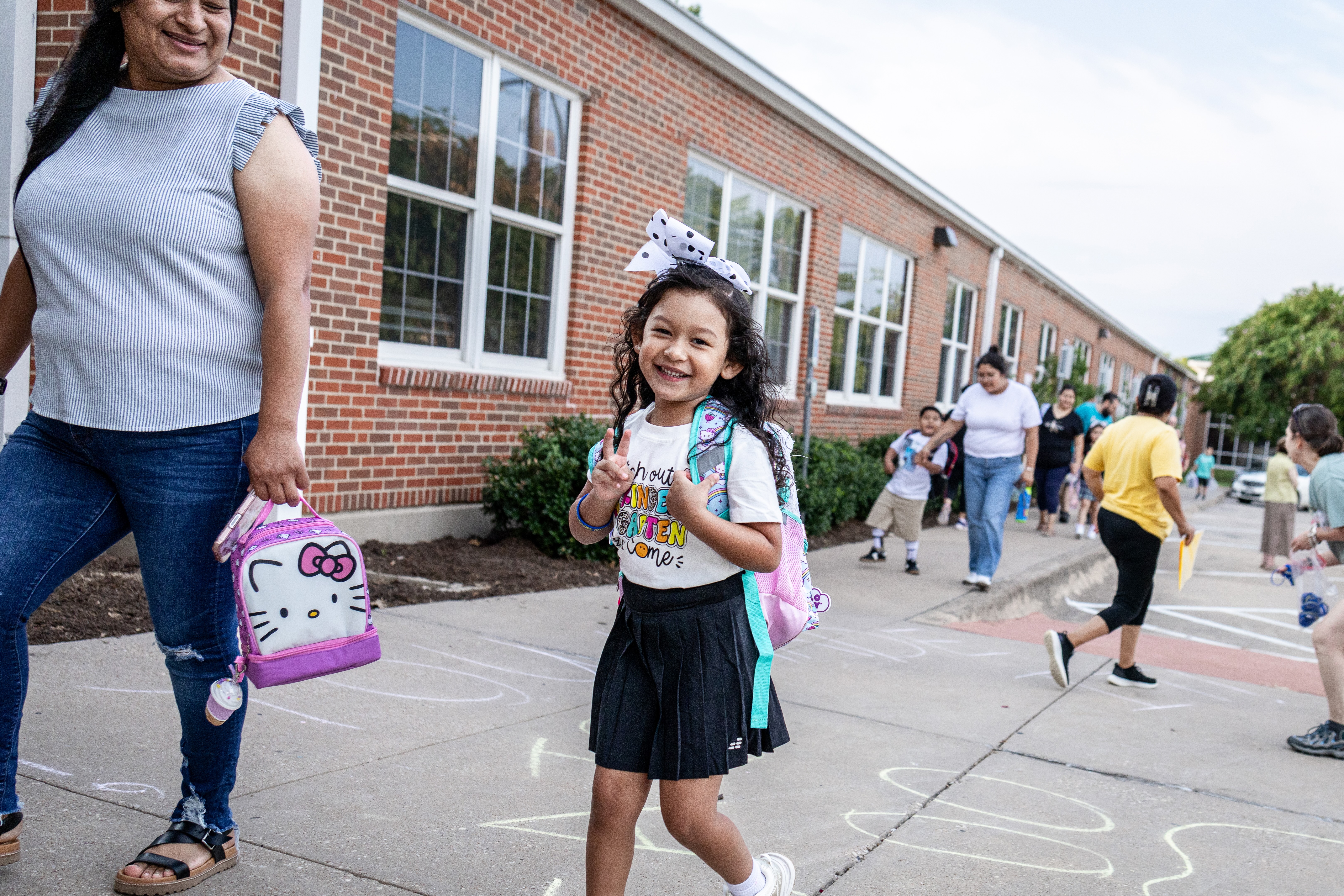 a kindergarten student walks into caldwell on the first day of school