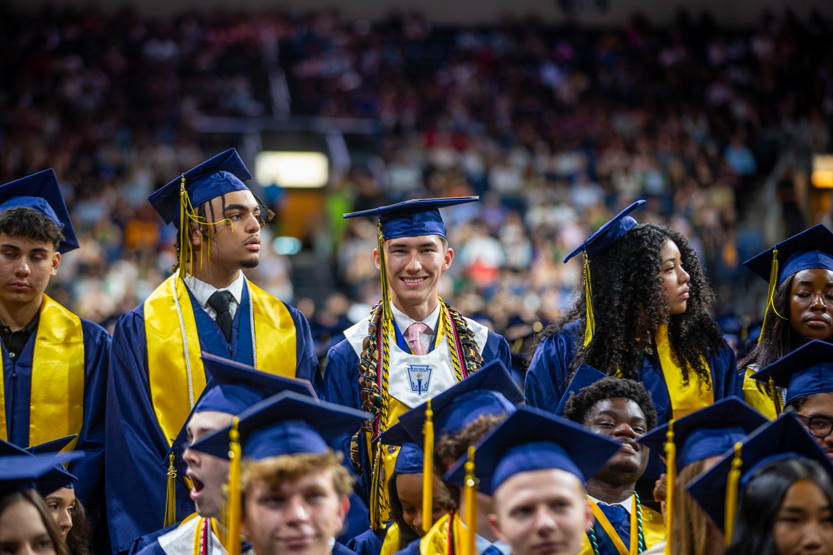 students at mckinney high school wait for the graduation ceremony to start