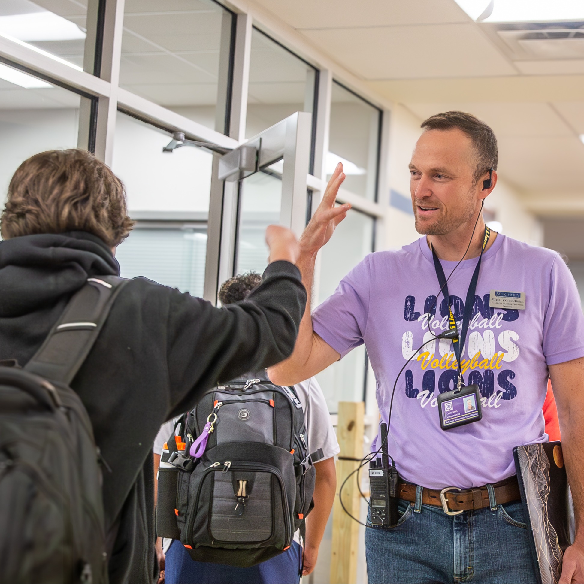 mr vandenboom the principal at faubion greets a student