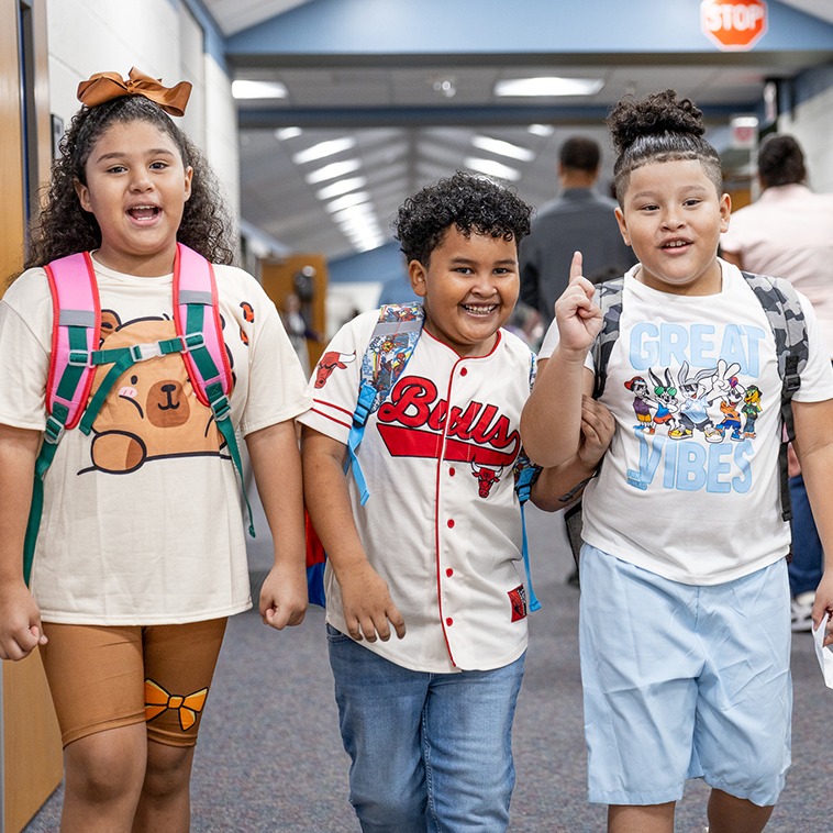 students walking down the hallway at caldwell dual language academy