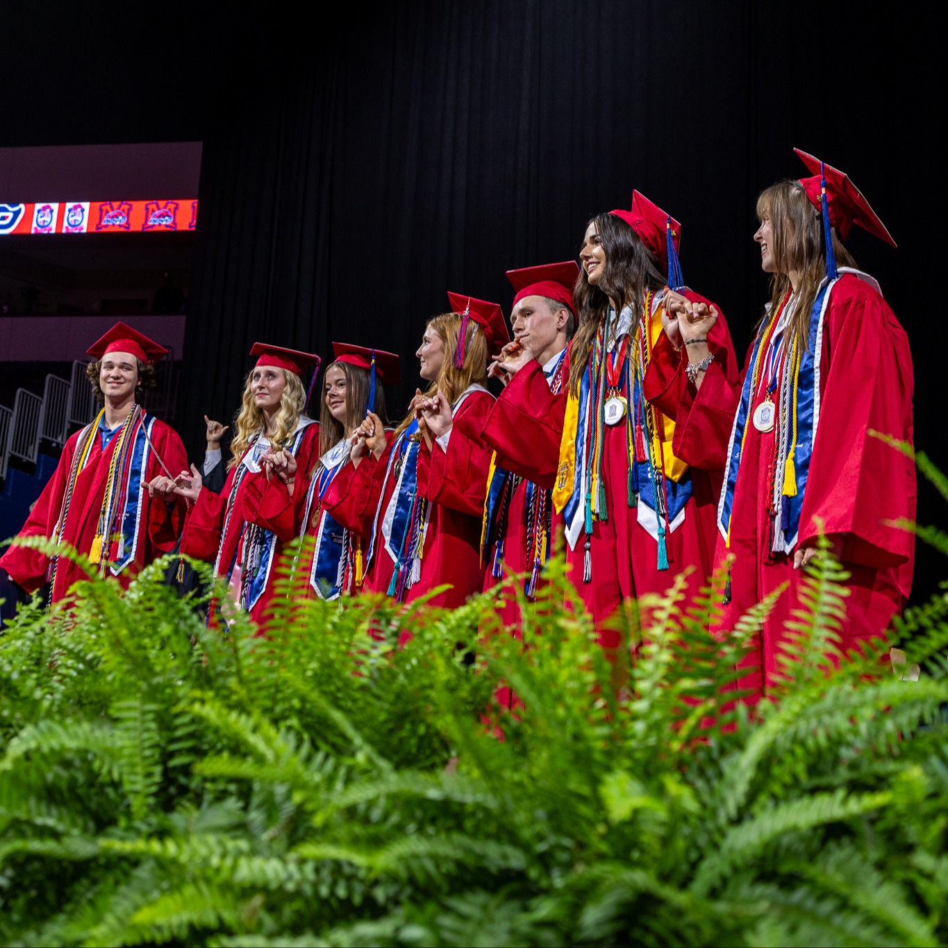 students at mckinney boyd high school wait for the graduation ceremony to start