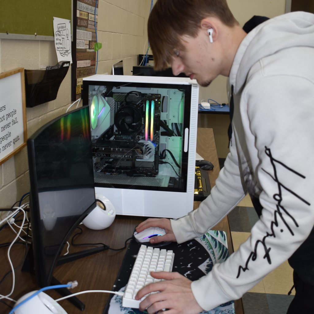 A person is deeply engaged with a computer