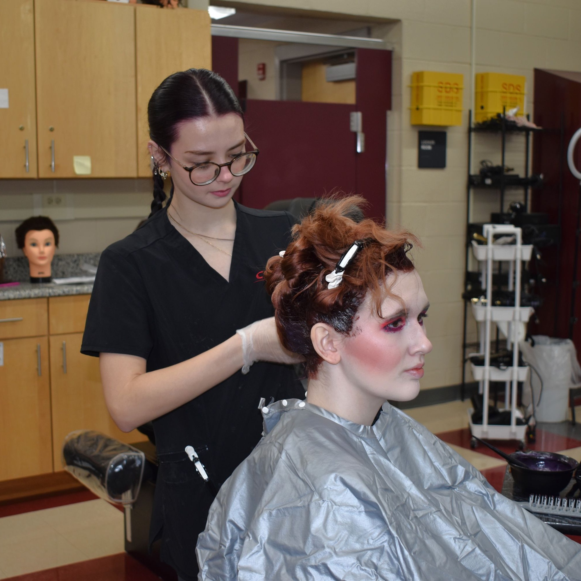 Student brushing hair