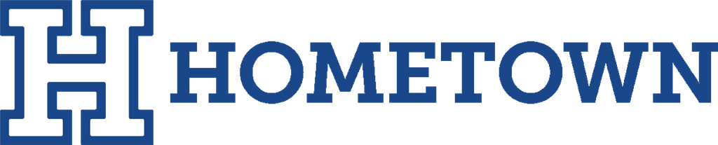 Home town logo with blue and white lettering, representing the pride and identity of the place.