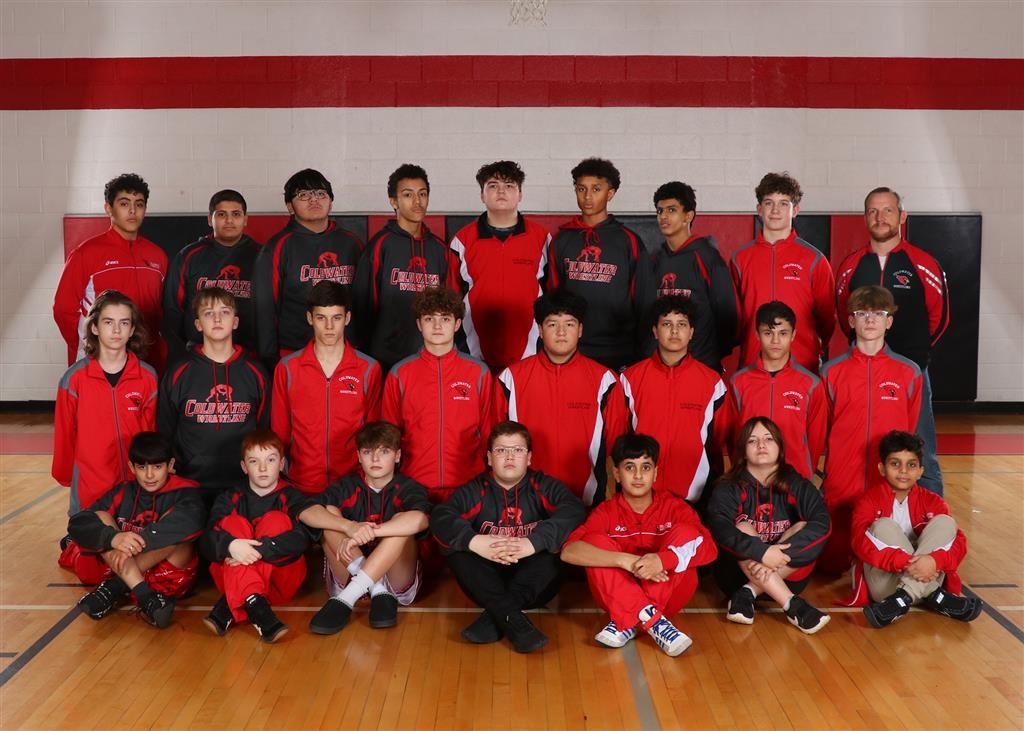 The boys and girls wrestling team posing for a group photo.