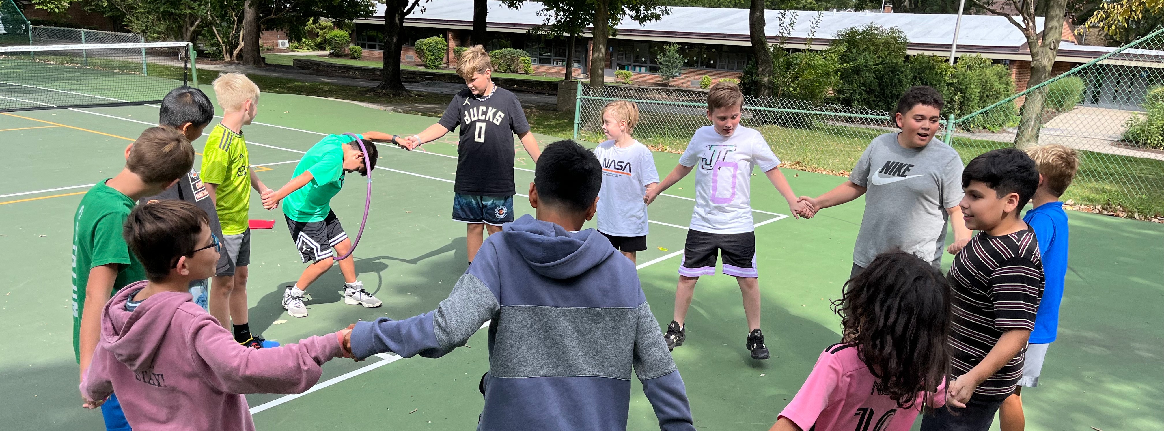 students playing on the tennis courts