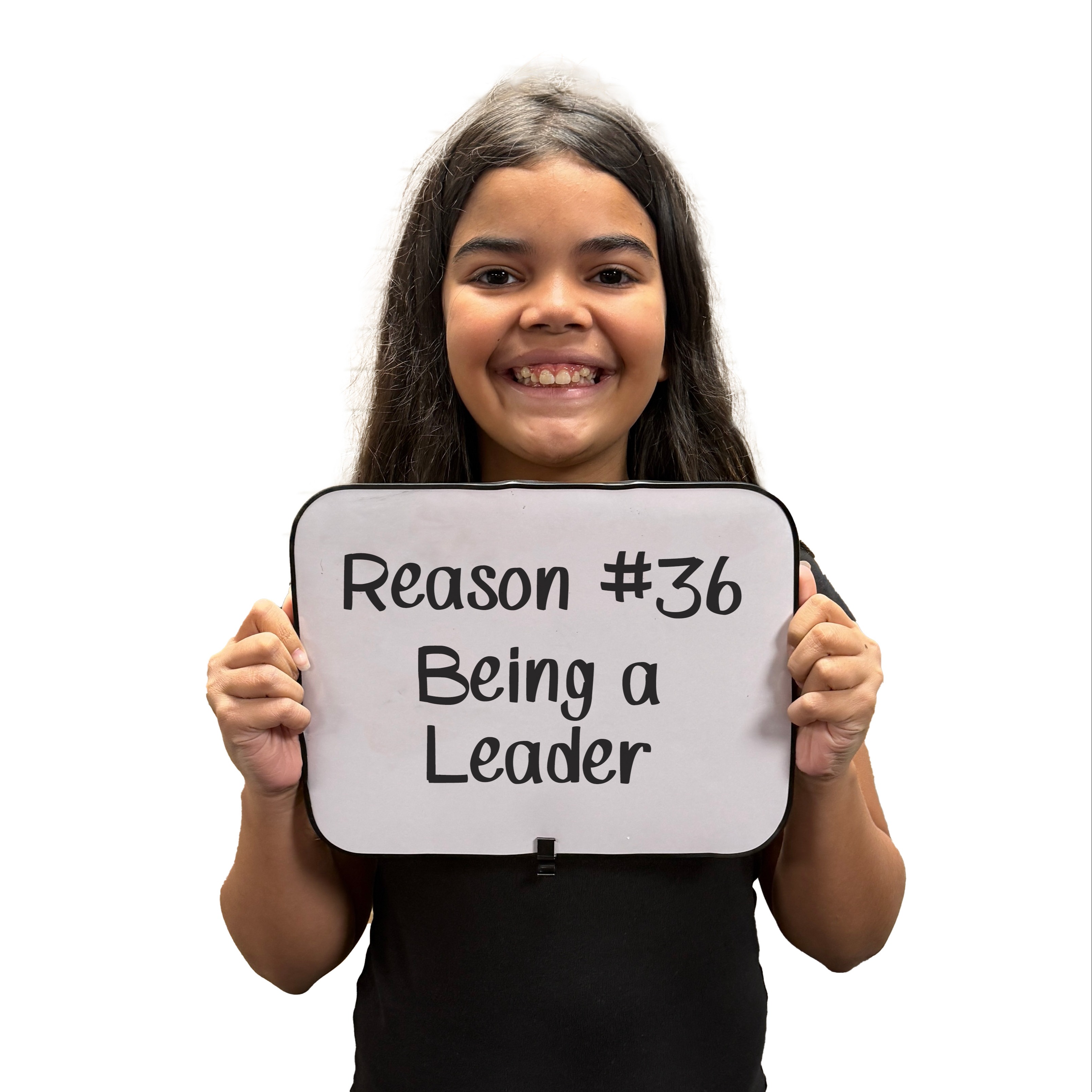 A female student holding a sign that says, Reason #36 Being a Leader, as her reason why she loves school.